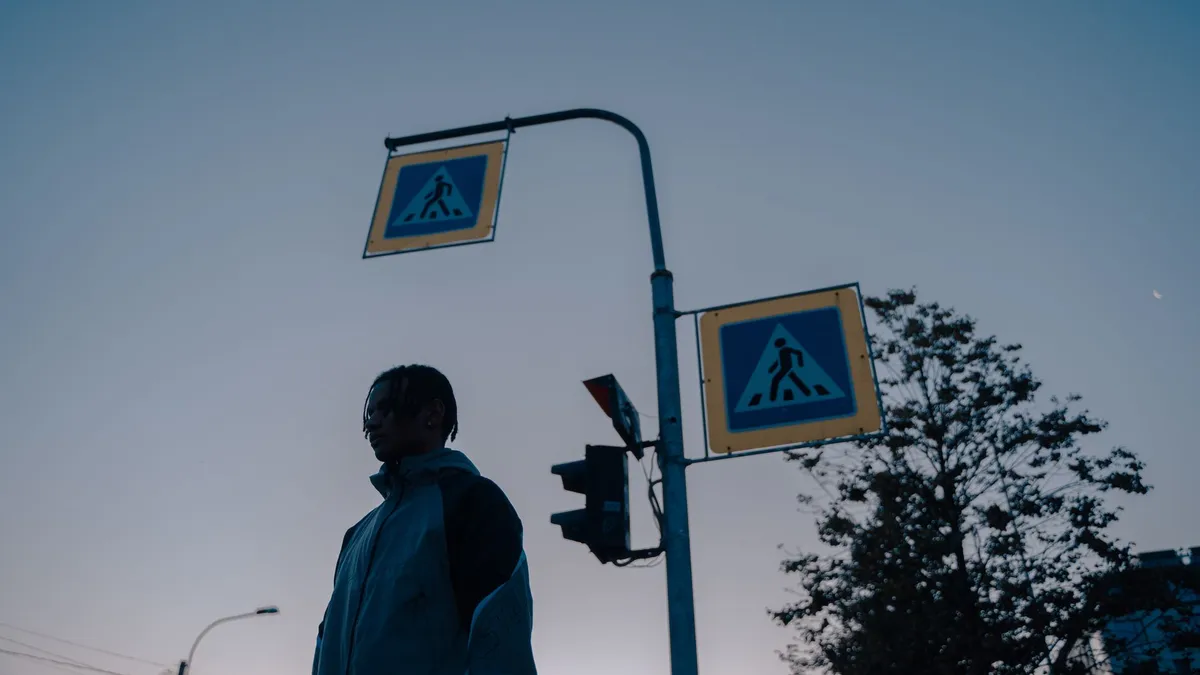 A traffic light against the sky