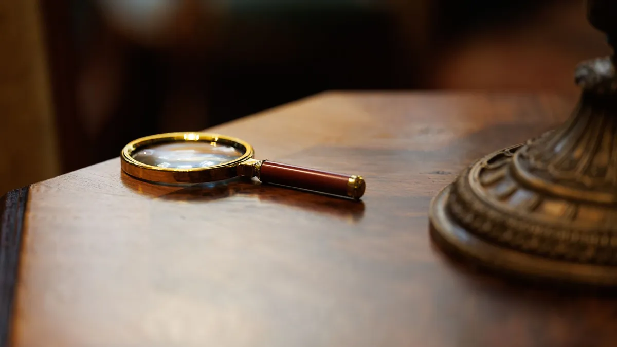 A magnifying glass on a desk