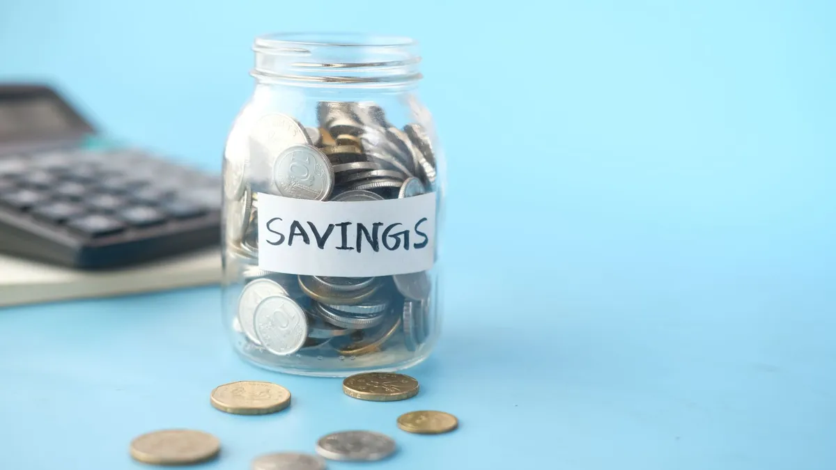 Coins saved in a glass jar