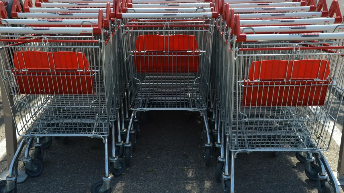 A shopping trolley in a supermarket aisle