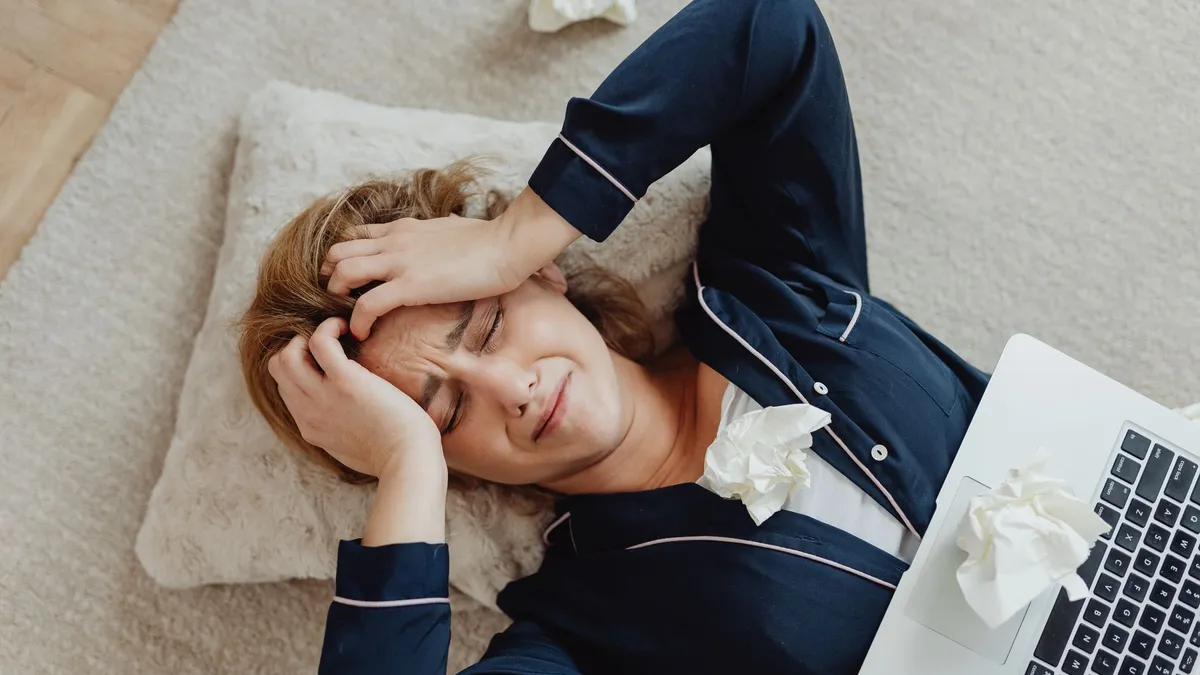 A stressed person at a computer