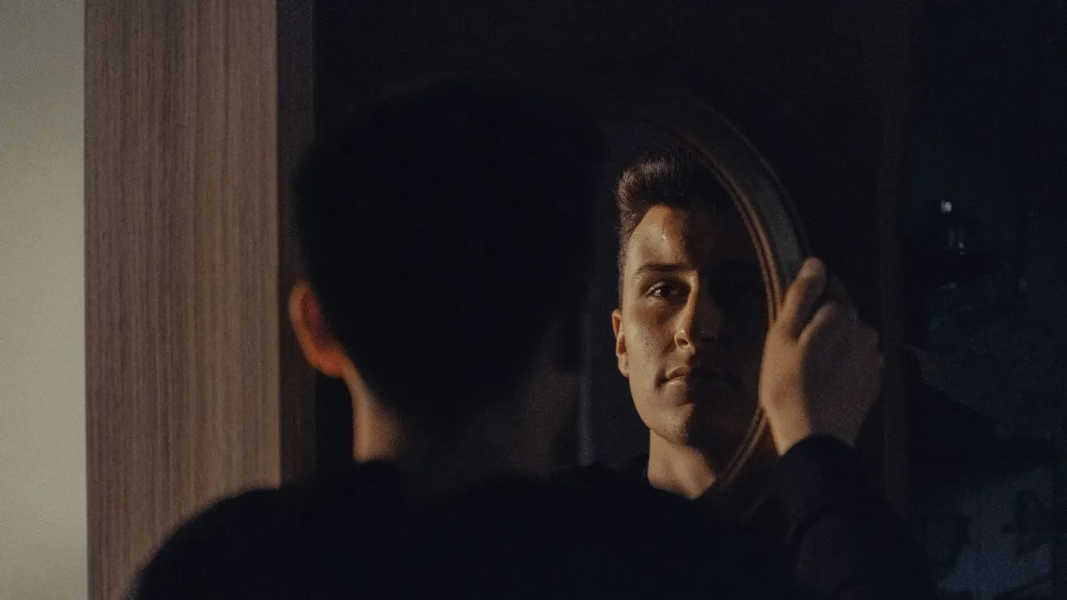 A person looking into a mirror